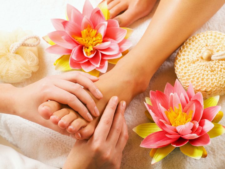 Lotus flowers next to foot massage.